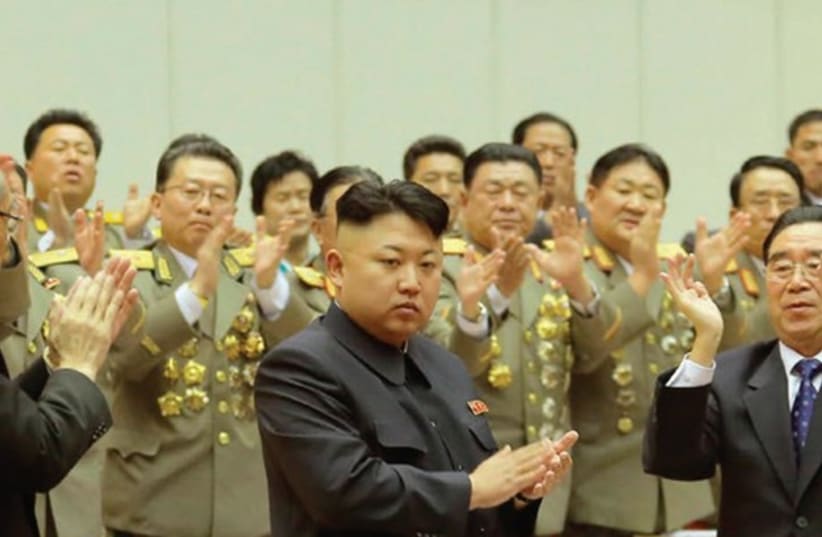 NORTH KOREAN leader Kim Jong Un applauds during the second day session of the 8th Conference of Ideological Officials of the Workers’ Party of Korea (photo credit: REUTERS)