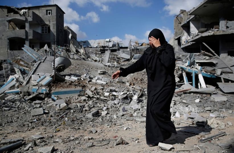 A Palestinian woman in the Gaza town of Beit Hanoun surveys the devastation (photo credit: REUTERS)