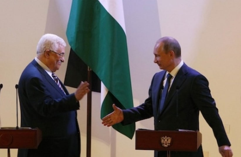 Russian President Vladimir Putin (R) and Palestinian Authority chief Mahmoud Abbas in Bethlehem (photo credit: REUTERS)
