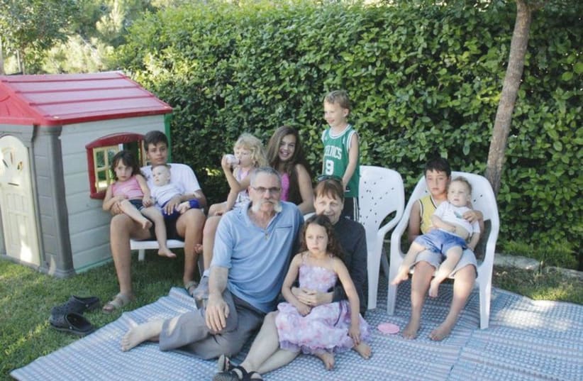 Yosef Avi Yair Engel, or Jucha, with his wife Yonit and children of kibbutz Ramat Rahel (photo credit: Courtesy)