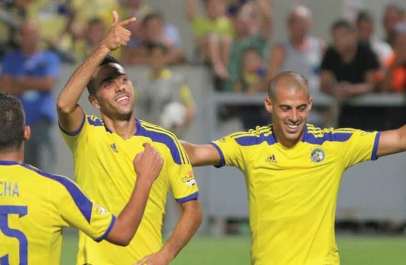 Maccabi Tel Aviv’s Eran Zahavi (left) and Tal Ben-Haim (right) both scored in the team’s 3-1 victory over Maccabi Haifa at Bloomfield Stadium. (photo credit: ADI AVISHAI)