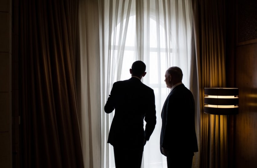 President Barack Obama and Israeli Prime Minister Benjamin Netanyahu look out a window before their lunch at the King David Hotel in Jerusalem (photo credit: OFFICIAL WHITE HOUSE PHOTO / PETE SOUZA)