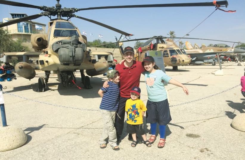 Elie Rosenblatt and his three children at the Air Force Museum near Beersheba. (photo credit: Courtesy)