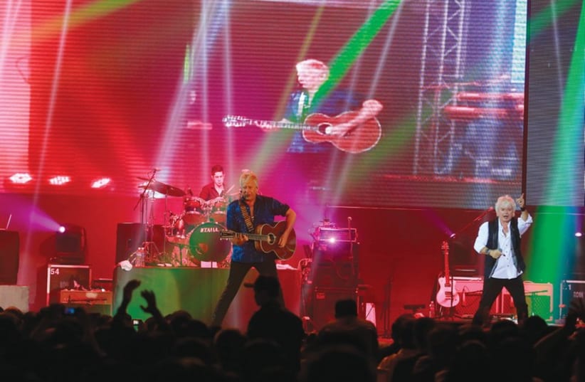 GRAHAM RUSSELL (left) and Russell Hitchcock of the band Air Supply perform during a concert in Yangon in 2013 (photo credit: REUTERS)