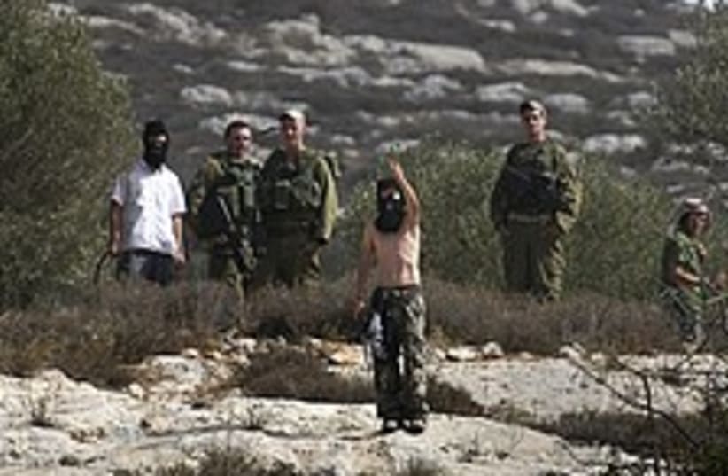 masked topless settler soldiers 224 88 (photo credit: AP)