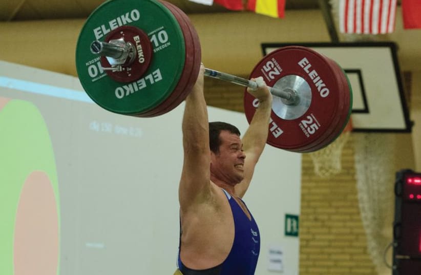 Project manager by day, world champion weightlifter by night (photo credit: Courtesy)