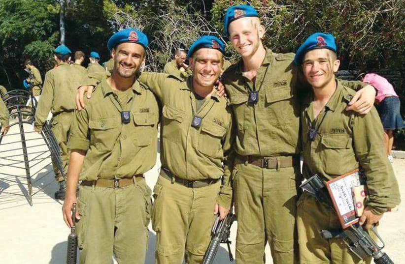 Lone soldiers who study at Yeshivat Hakotel take a break from training at their base. (photo credit: Courtesy)