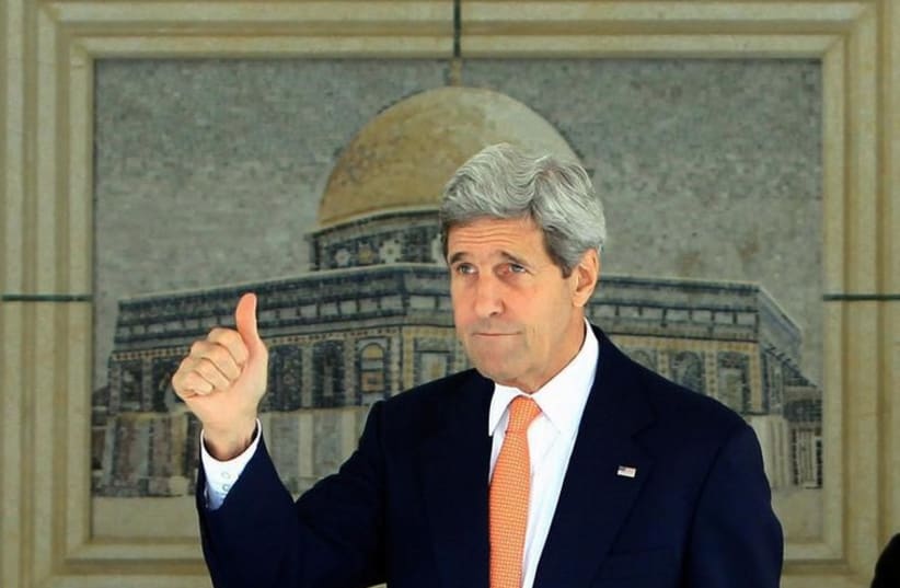 US Secretary of State John Kerry gestures before meeting the Palestinian leadership in Ramallah (photo credit: REUTERS)