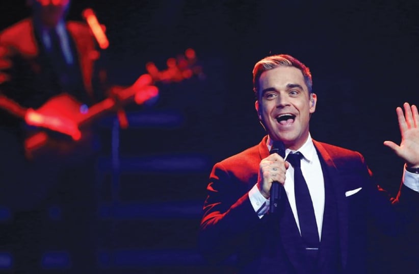 British singer Robbie Williams performs in Berlin (photo credit: REUTERS)
