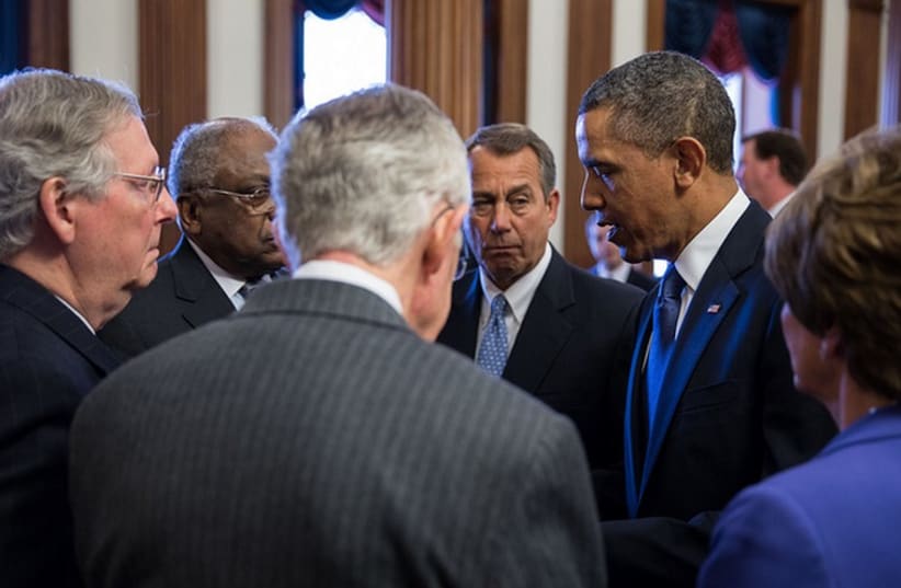 President Barack Obama talks with Congressional leaders (photo credit: OFFICIAL WHITE HOUSE PHOTO BY PETE SOUZA)