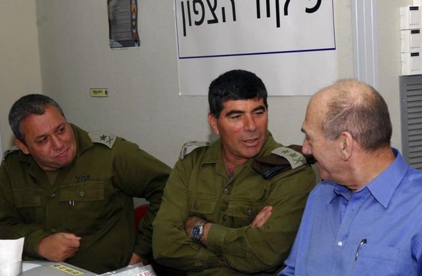 From left, Maj.-Gen. Gadi Eizenkot, former IDF chief of staff Gabi Ashkenazi, and former Prime Minister Ehud Olmert (photo credit: REUTERS)