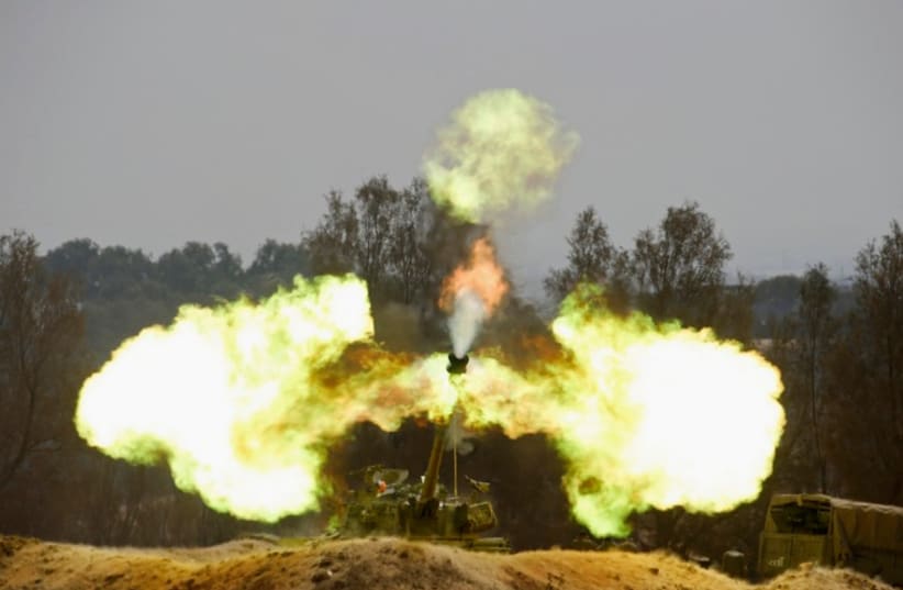 An Israeli mobile artillery unit fires towards southern Gaza on August 1, 2014 (photo credit: REUTERS)