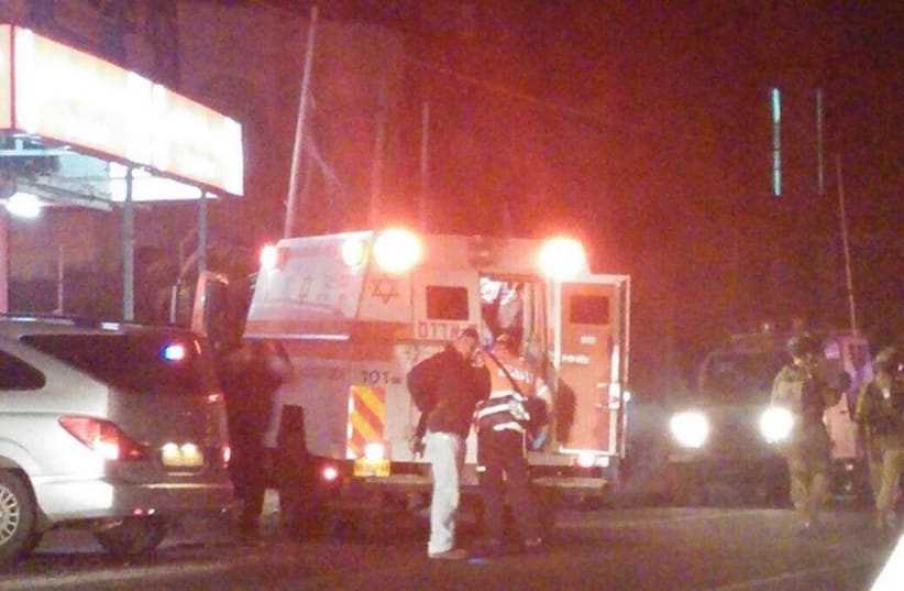 Emergency team at the scene of a hit and run at Gush Etzion junction. (photo credit: HAR HEVRON SPOKESMAN)