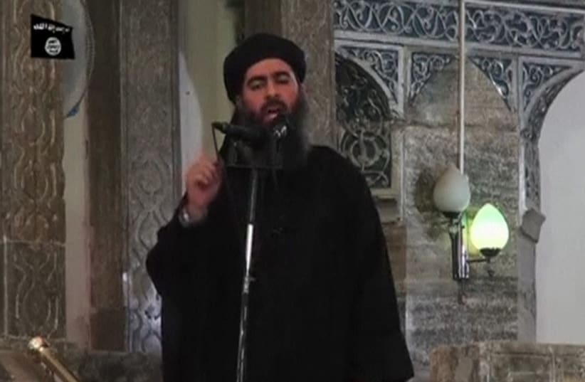 A man purported to be the reclusive leader of the militant Islamic State Abu Bakr al Baghdadi made a rare public appearance at a mosque in the center of Mosul, on July 5, 2014. (photo credit: REUTERS)