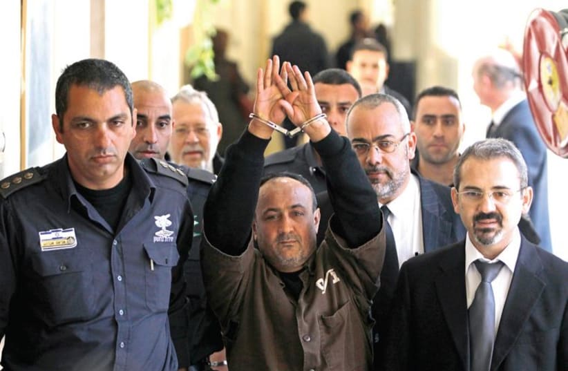 Jailed Fatah leader Marwan Barghouti would win elections for Palestinian president according to a poll held in early summer by the Palestinian Center for Public Opinion. (photo credit: REUTERS/BAZ RATNER)