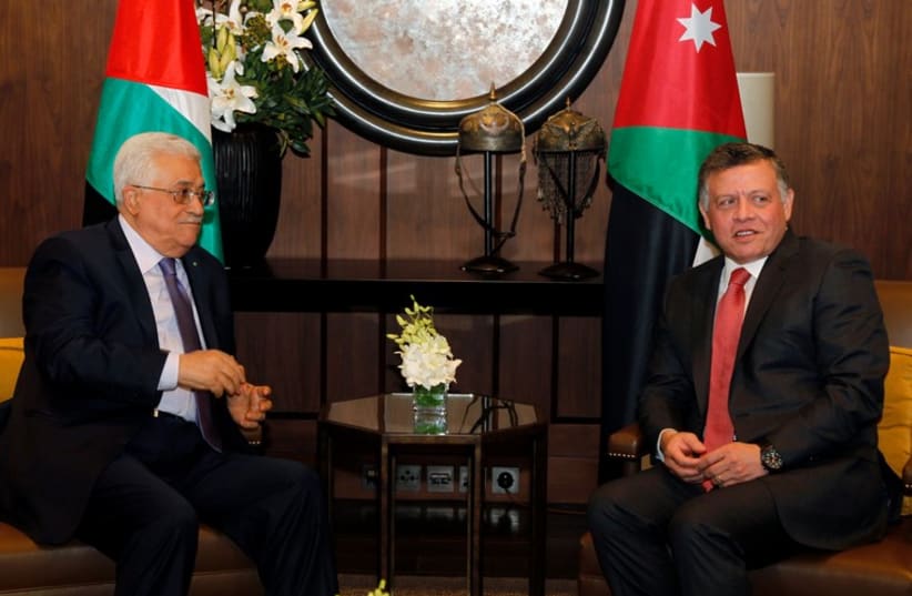 Jordan's King Abdullah meets with Palestinian Authority President Mahmoud Abbas at the Royal Palace in Amman November 12 (photo credit: REUTERS)