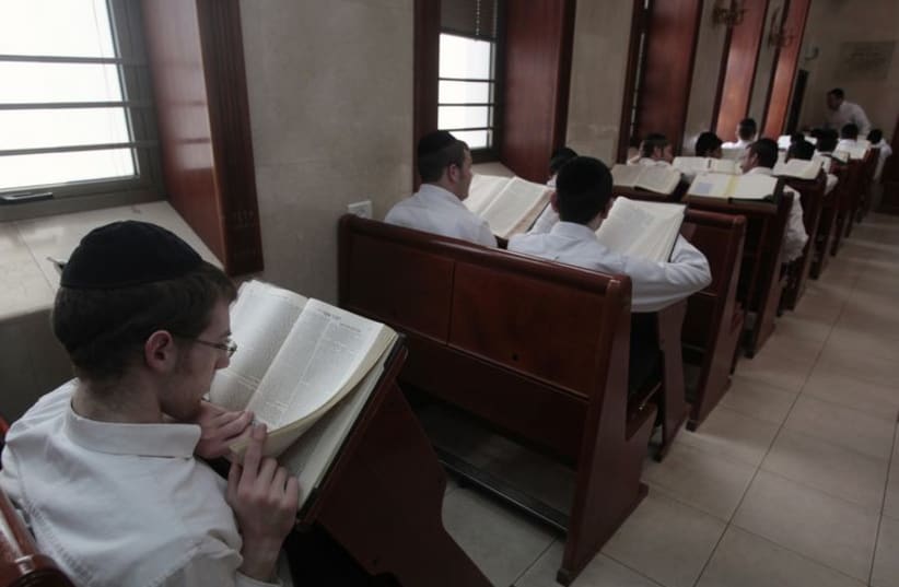 Ultra-Orthodox Jewish youths study religious texts at a synagogue in Jerusalem April 7, 2011. (photo credit: REUTERS)