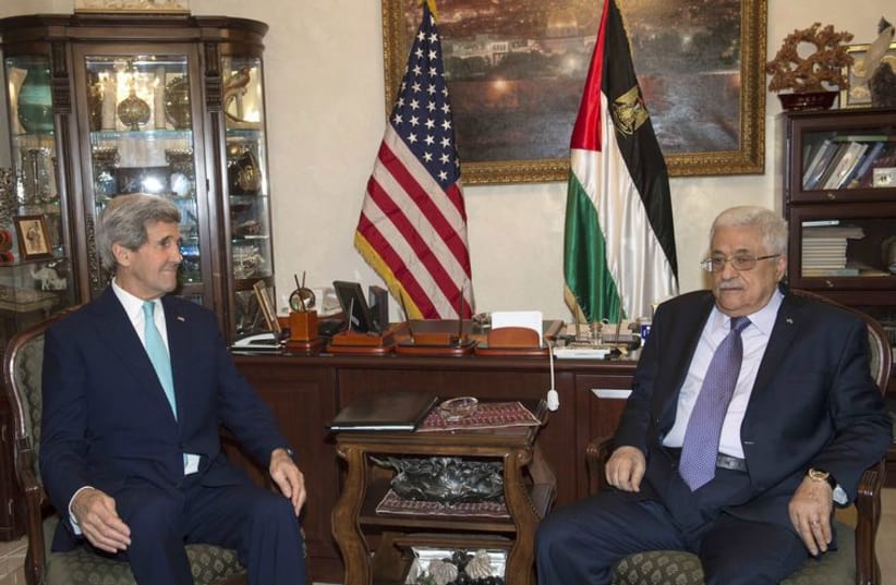 U.S. Secretary of State Kerry meets with Palestinian President Abbas in Amman. (photo credit: REUTERS)