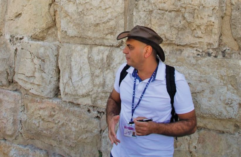 Author and journalist Shlomo Cesana explores the stories behind some of the capital’s unique stone marks. (photo credit: Courtesy)