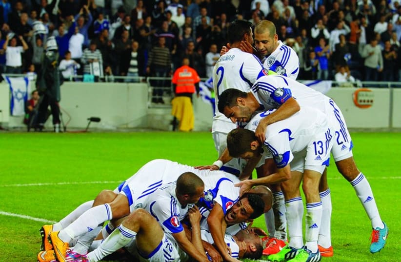 Israel’s players celebrate 3-0 win over Bosnia-Herzegovina at Sammy Ofer Stadium in Haifa (photo credit: ERAN LUF)