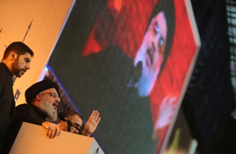 Hezbollah leader Hassan Nasrallah addresses his supporters during a rare public appearance in Beirut, November 3 (photo credit: REUTERS)