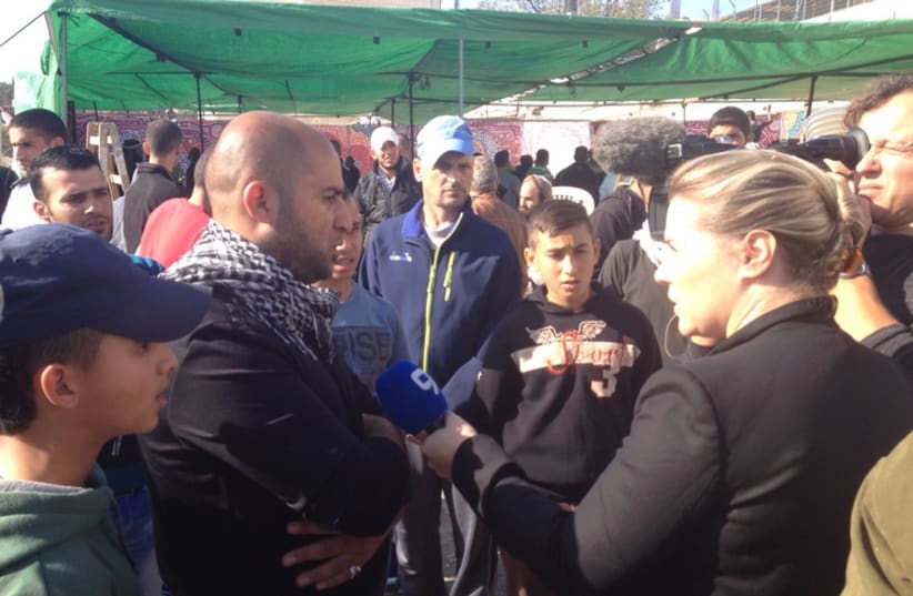 Family members of terrorist cousins discusses their motivations to media at mourners tent (photo credit: SETH J. FRANTZMAN)