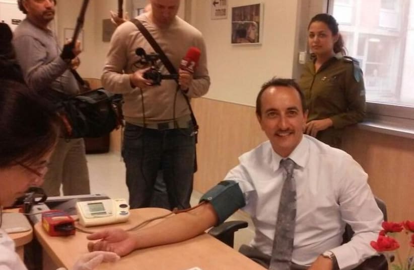 Australian Ambassador Dave Sharma giving blood at Hadassah on Wednesday. (photo credit: PR)