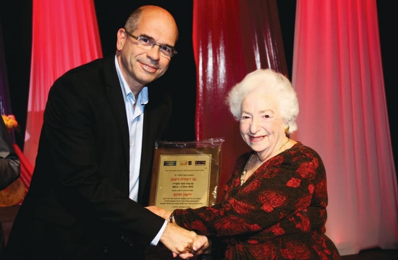 Petah Tikva Mayor Itzik Braverman grants the Shabazi Prize to Dvora Waysman. (photo credit: GIDI LIVYATAN)