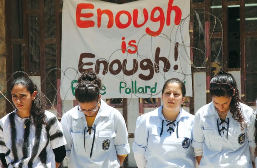 Young women in the Bnei Akiva youth movement wear mock prison outfits to protest the continued imprisonment of Jonathan Pollard, on July 4, 2011. (photo credit: MARC ISRAEL SELLEM/THE JERUSALEM POST)