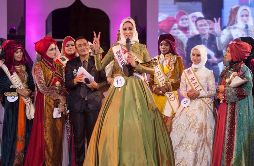  Fatma Ben Guefreche from Tunisia speaks after being named the winner of the fourth annual World Muslimah award in Indonesia. (photo credit: REUTERS)