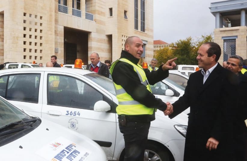 Jerusalem Mayor Nir Barkat announces the deployment of 90 new patrol cars in the city (photo credit: MARC ISRAEL SELLEM)