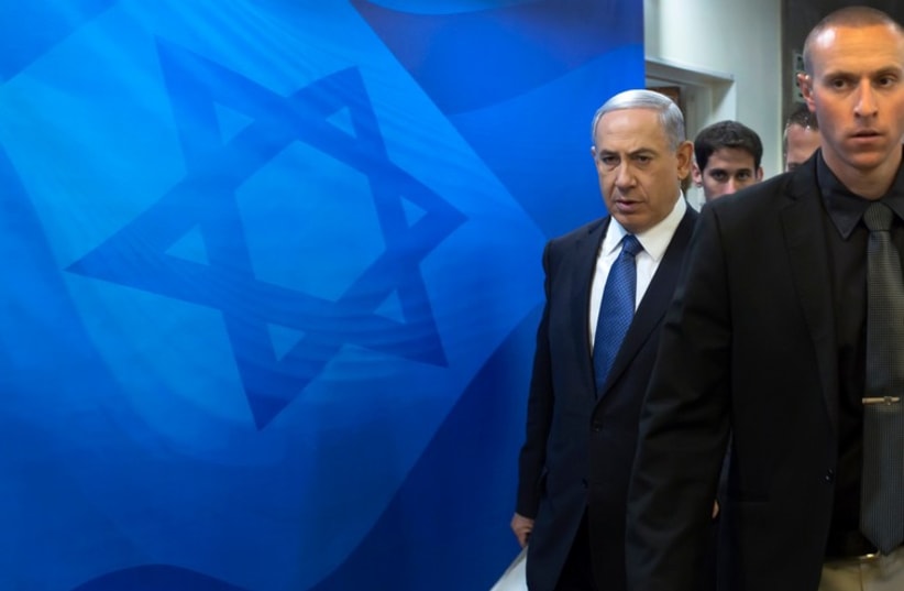 Prime Minister Benjamin Netanyahu arrives to the weekly cabinet meeting in Jerusalem November 23 (photo credit: REUTERS)