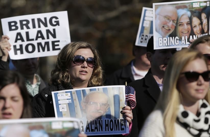 Demonstrators gather during a rally for U.S. detainee Alan Gross in Lafayette Square in Washington (photo credit: REUTERS)