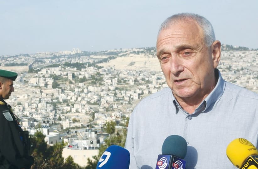 Public Security Minister Yitzhak Aharonovitch addresses Jerusalem’s security situation December 2 while overlooking Jabl Mukaber (photo credit: MARC ISRAEL SELLEM)