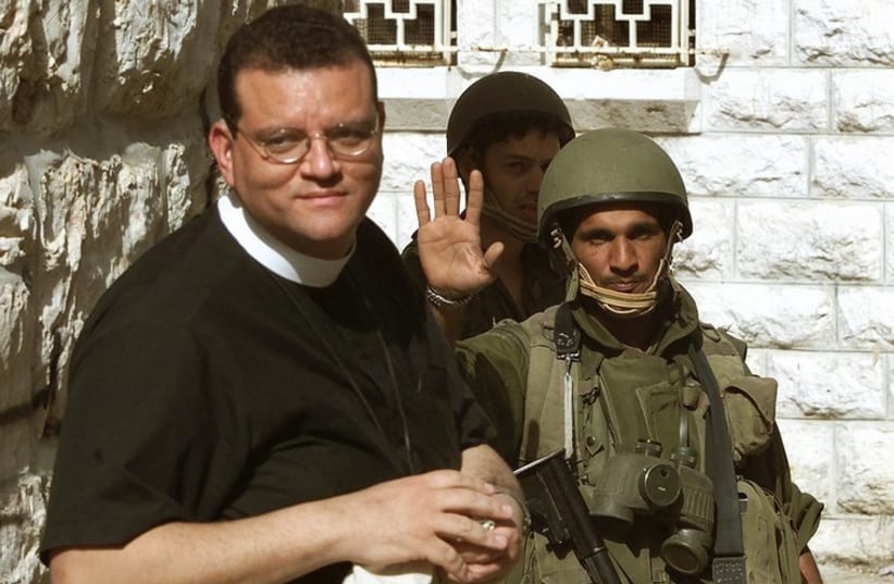 Canon Andrew White, a Christian archbishop from England, as he is turned away by an IDF soldier from entering Bethlehem (photo credit: REUTERS)