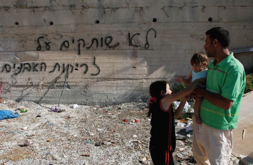 Graffiti at Beit Hanina (photo credit: REUTERS)