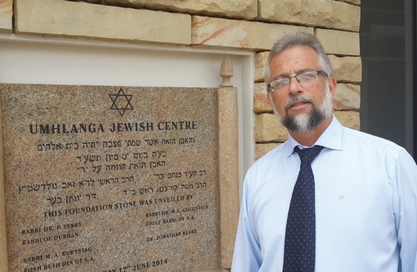 RABBI PINCHAS ZEKRY stands at the entrance to the Umhlanga Jewish Center (photo credit: STEVE LINDE)