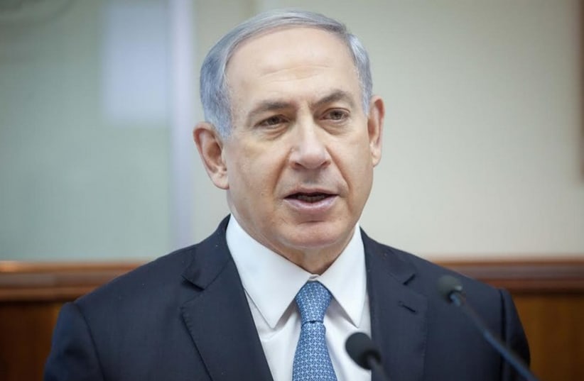Prime Minister Benjamin Netanyahu addresses the weekly cabinet meeting in Jerusalem, December 7, 2014. (photo credit: EMIL SALMAN/POOL)