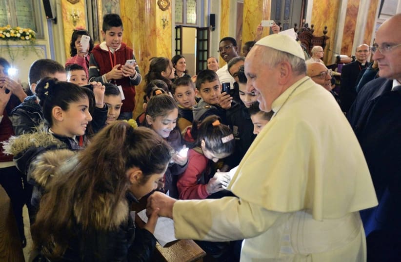 Pope Francis greets Christian children in the Middle East (photo credit: REUTERS)