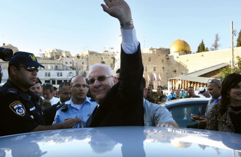 Rivlin waves after visiting the Western Wall (photo credit: MARC ISRAEL SELLEM/THE JERUSALEM POST)