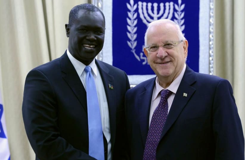 South Sudan Ambassador to Israel MR. RUBEN MARIAL BENJAMIN with President Rivlin (photo credit: Mark Neiman/GPO)