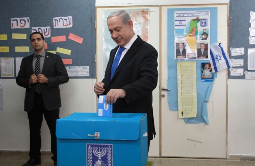 Prime Minister Benjamin Netanyahu casts his ballot in the 2013 election[File] (photo credit: MARC ISRAEL SELLEM/THE JERUSALEM POST)