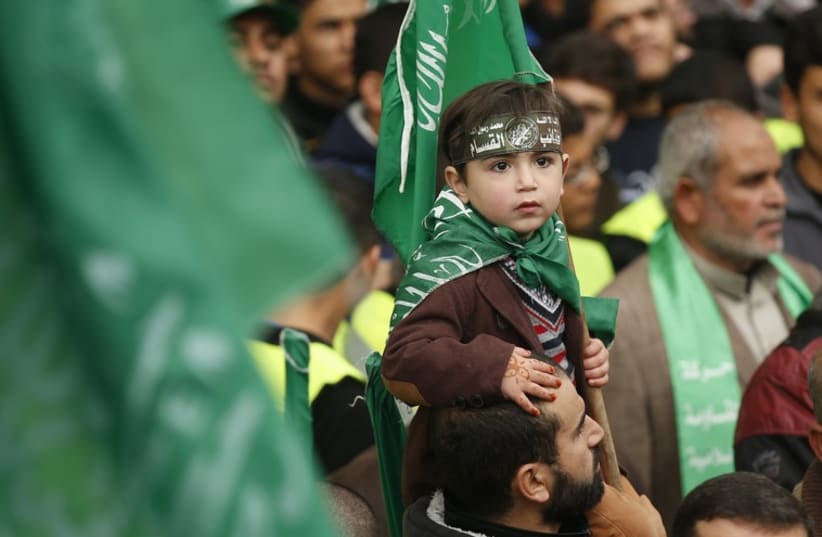 Gazans celebrate the 27th anniversary of Hamas' founding (photo credit: REUTERS)