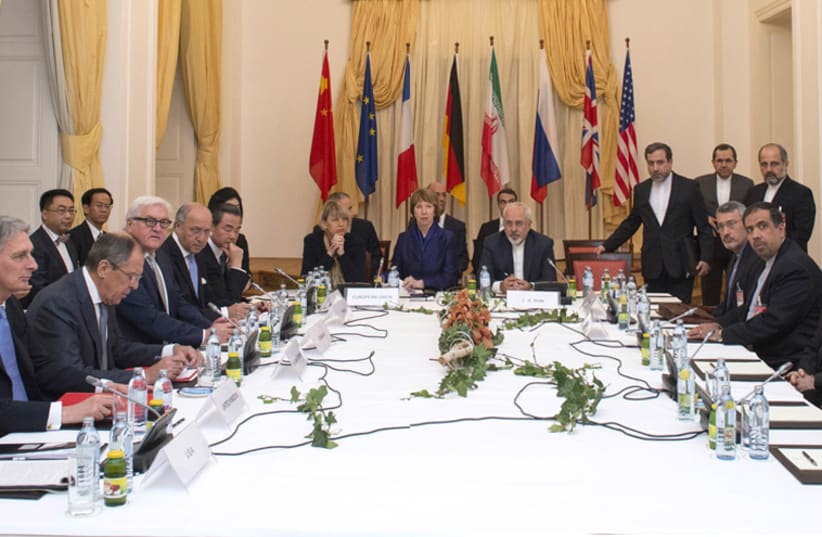 The delegations of the US, Britain, Russia, Germany, France, EU and China meet with the Iranian representatives in Vienna, November 24. (photo credit: REUTERS)