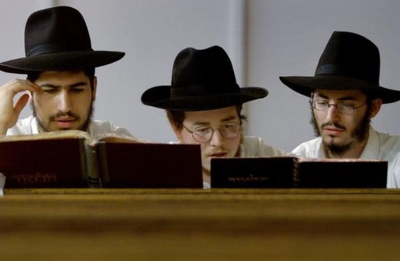 Yeshiva students pray in a synagogue (photo credit: REUTERS)