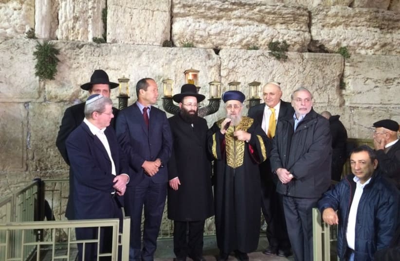 Mayor of Jerusalem Nir Barkat and Chief Rabbi Yitzhak Yosef brought in the Hanukka holiday Tuesday evening at a ceremony by the Western Wall (photo credit: WESTERN WALL HERITAGE FOUNDATION)