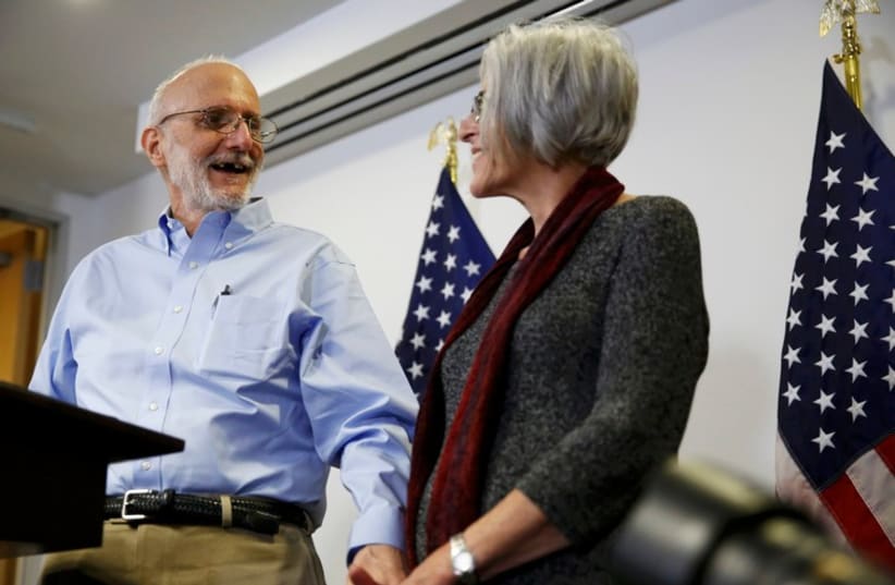 Alan Gross pictured with his wife Judy while addressing a news conference in Washington after his release from Cuba,December 17, 2014. (photo credit: REUTERS)