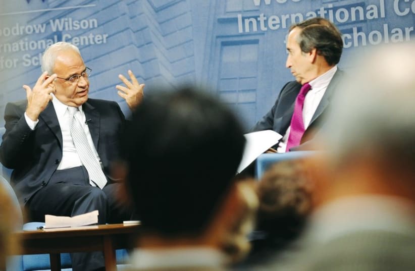 Aaron David Miller moderates a question-and-answer forum in November 2010 with then-senior Palestinian negotiator Saeb Erekat (photo credit: REUTERS)