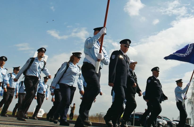 Police march on Remembrance Day. (photo credit: REUTERS)
