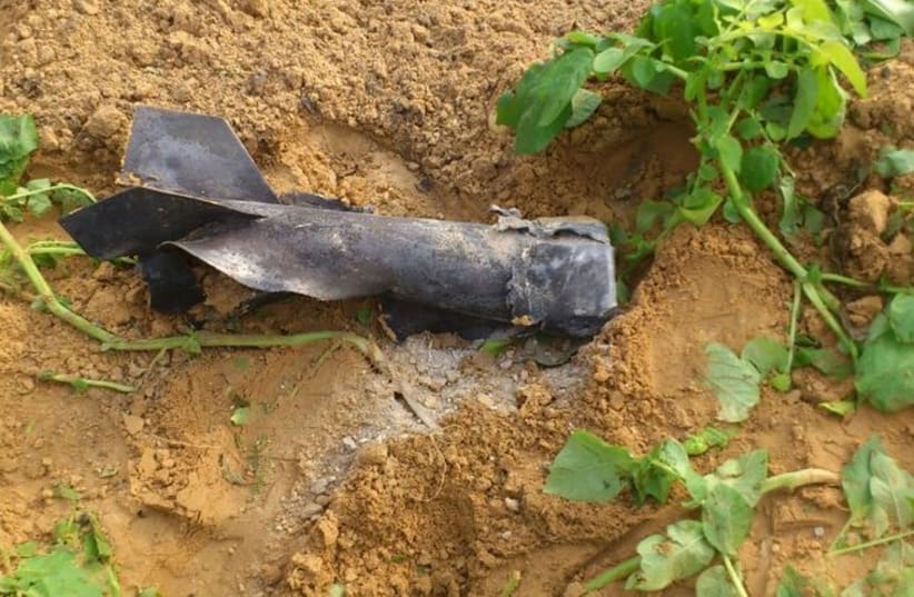 Rocket fragment found by secuirty forces in an open field, December 19,2014 (photo credit: Courtesy)